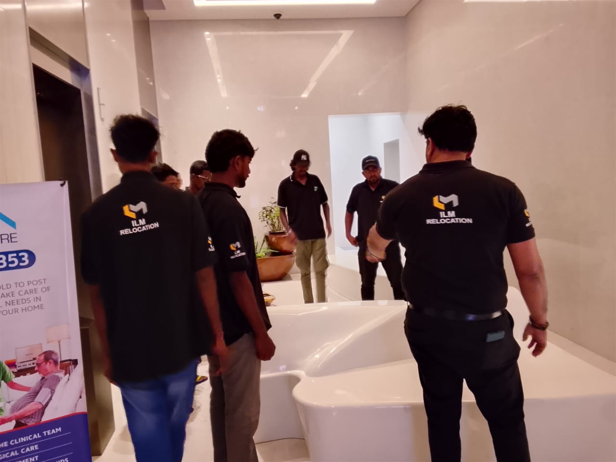 ILM Relocation crew briefing inside an apartment before a household move